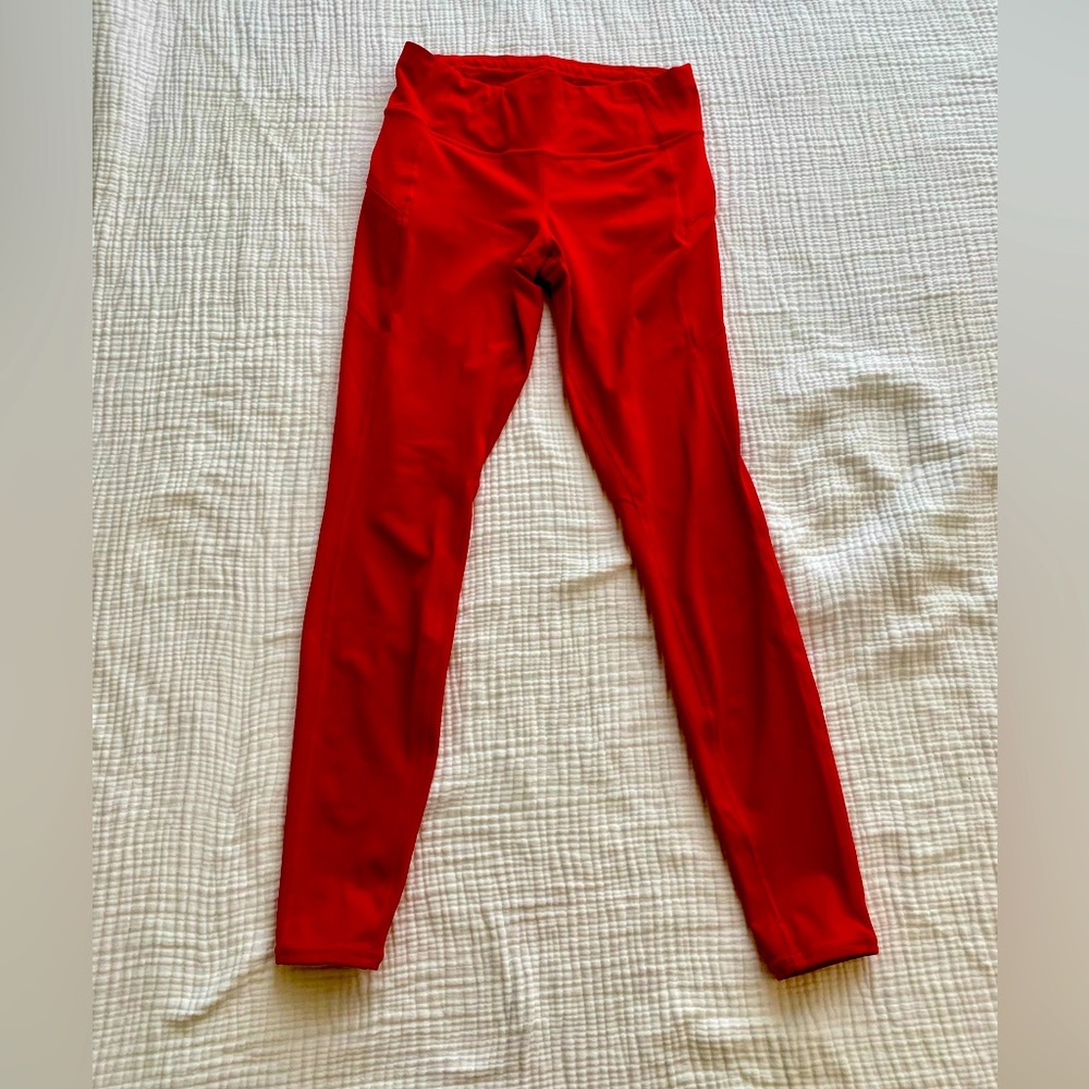 Athleta red 7/8 leggings with side pocket zippers